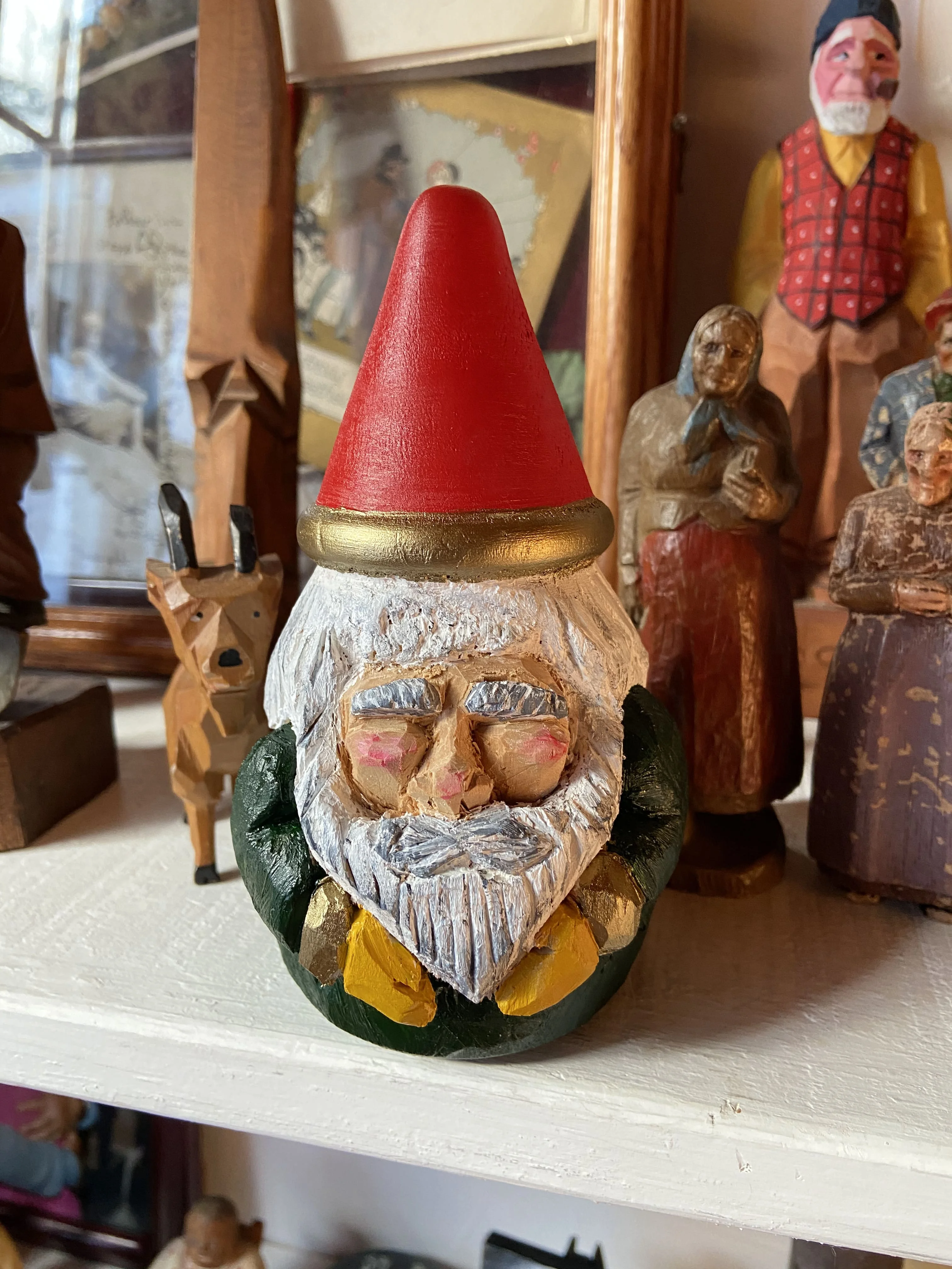 Painted gnome carving from Poppi